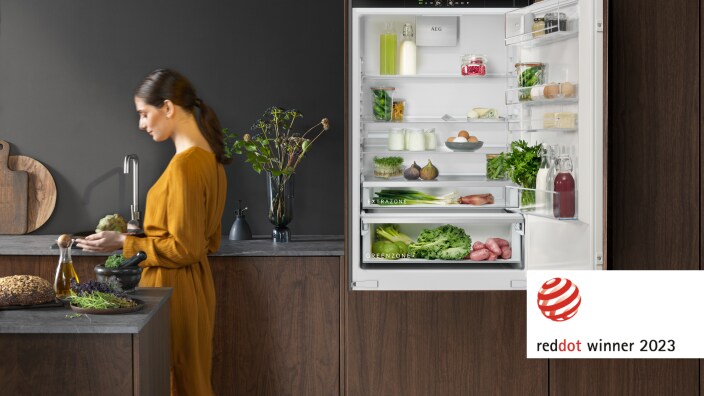 Woman in a kitchen.