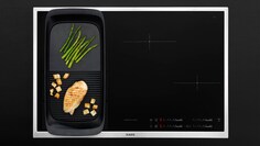 A MaxiSense Combi indukciós főzőlap, felületén plancha grill-lel